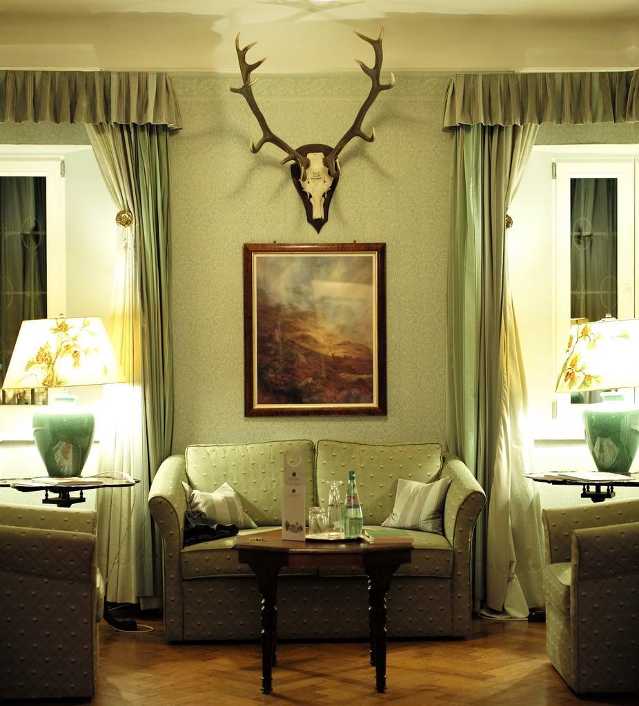 Immagine di Lerbach. leica travel light architecture germany hotel design europe sitting natural interior room hunting m deer antlers sofa trophy suite 50 schloss summilux available hunt 240 relaischateaux lerbach jagdsuite