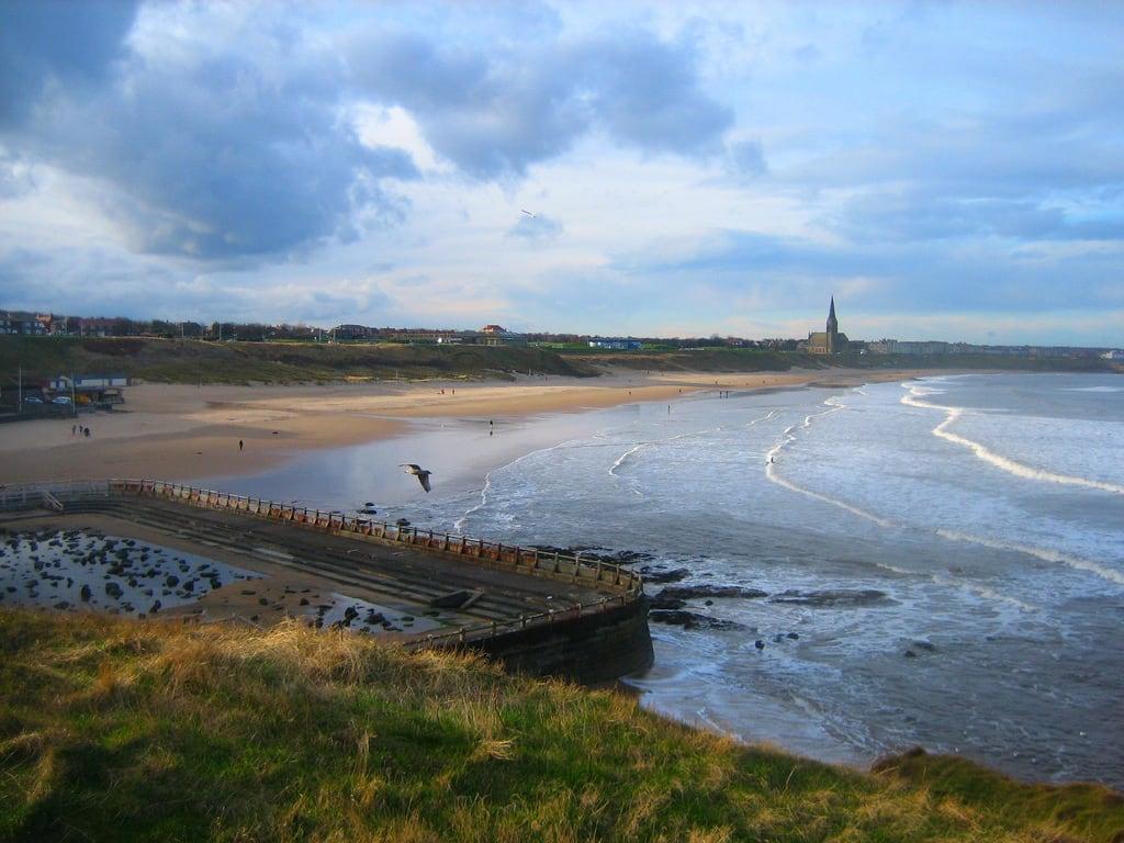 Image of Tynemouth Pool. sea beach church pool coast surf day cloudy steeple stgeorges northsea surfers tynemouth cullercoats longsands