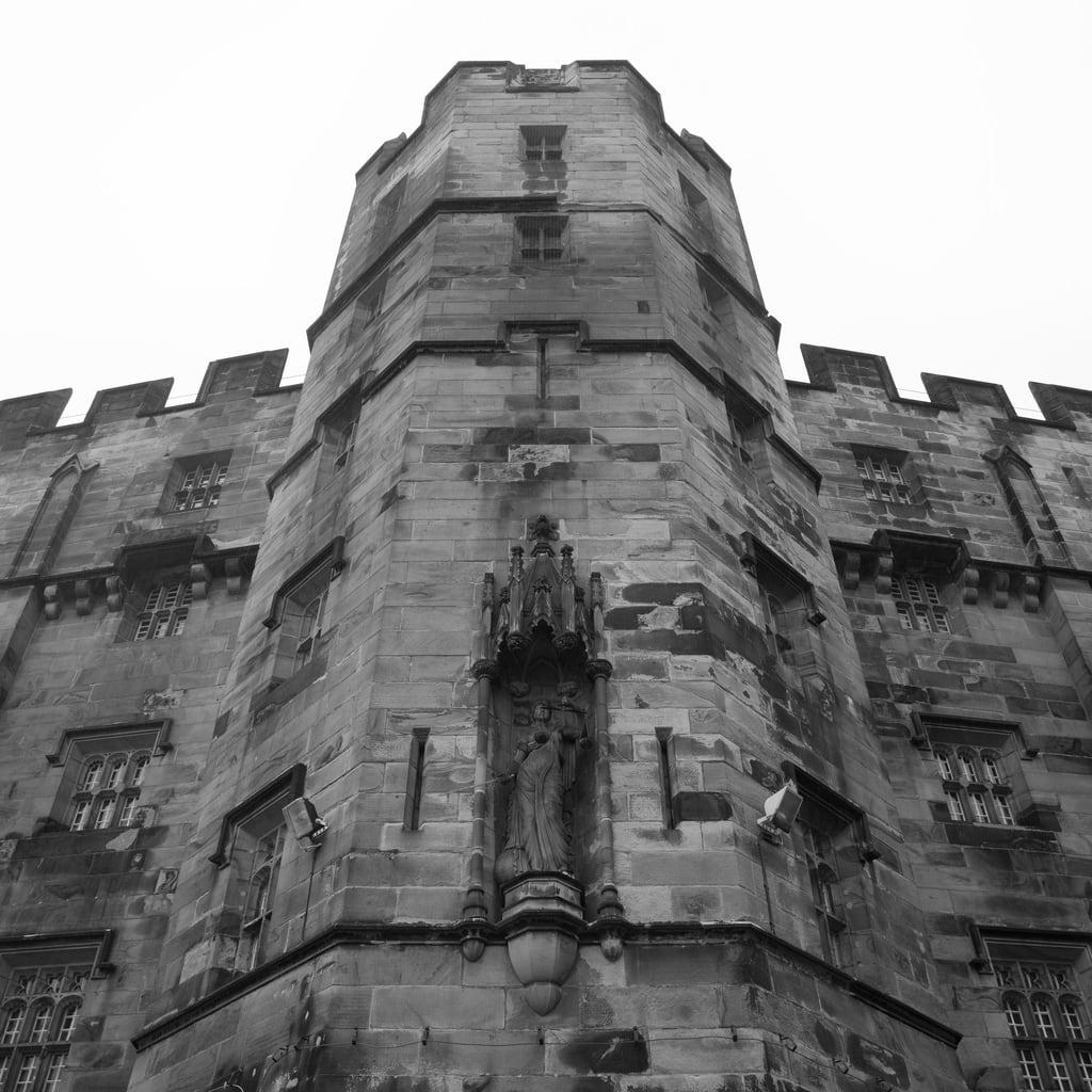 Image of Lancaster Castle. lancastercastle castle prison jail listed gradei monochrome desaturated square crop cropped statue justice scales lancaster lancashire england archhist itmpa tomparnell canon 6d canon6d