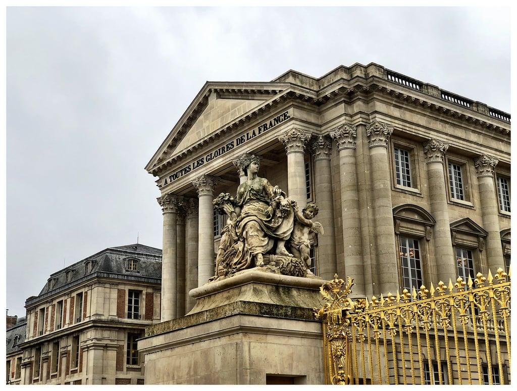 Image of Palace of Versailles. paris france versailles palace statue entrance