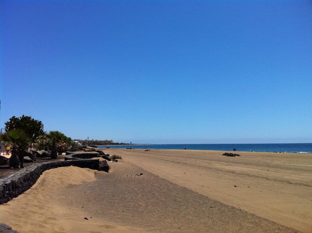 Изображение на Playa de los Pocillos. sky sun holiday weather clouds view lanzarote iphoneography